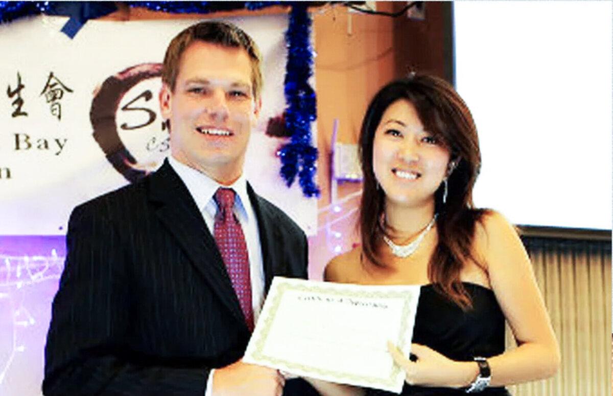 Christine Fang with then-Dublin City Councilmember Eric Swalwell at a student event in October 2012. (Screenshot/Social media)