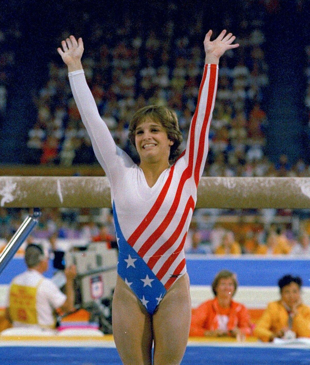 Mary Lou Retton reacts to applause after her performance at the Summer Olympics in Los Angeles on Aug. 3, 1984. (Suzanne Vlamis/AP Photo)