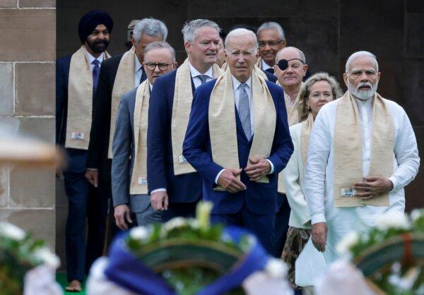 India's Prime Minister Narendra Modi (R), U.S. President Joe Biden (C), German Chancellor Olaf Scholz (3rd R), Australia's Prime Minister Anthony Albanese (3rd L), and other world leaders arrive to pay respects at the Mahatma Gandhi memorial at Raj Ghat on the sidelines of the G20 summit in New Delhi, India, on Sept. 10, 2023. (LUDOVIC MARIN/POOL/AFP via Getty Images)