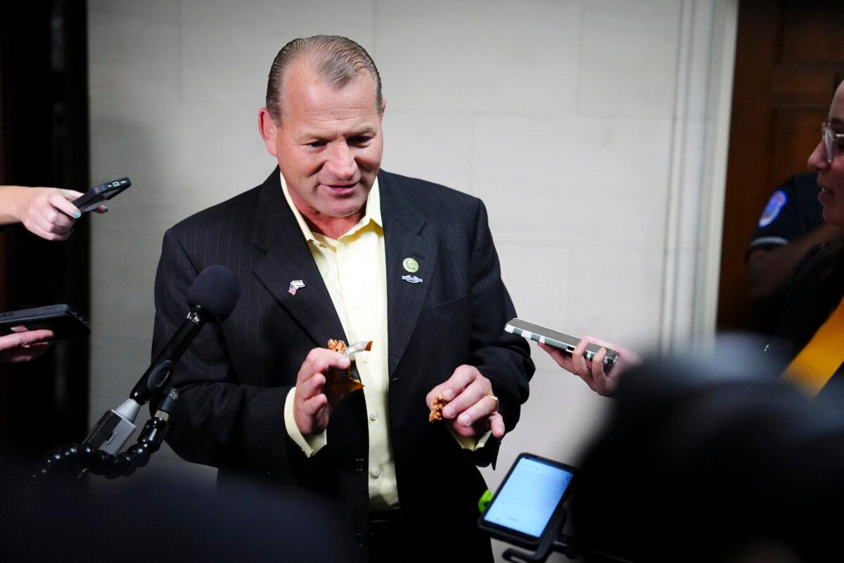 Rep. Troy Nehls (R-Texas) speaks with reporters after the House Republicans meeting securing the GOP nomination for House Speaker in Washington on Oct. 11, 2023. (Madalina Vasiliu/The Epoch Times)