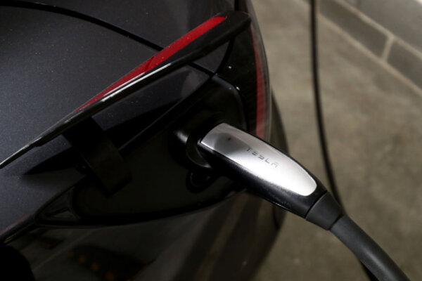 A Tesla Model Y charges at a EV charge station in Sydney, Australia, on Jan. 19, 2021. (Brendon Thorne/Getty Images)
