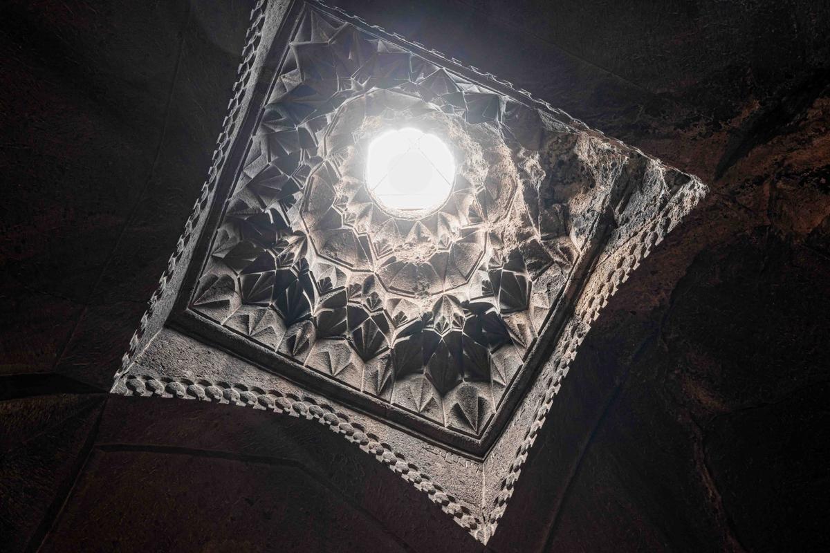 A portal crown with ornate carvings in the ceiling of the gavit at Geghard allows natural light to enter. (frantic00/Shutterstock)