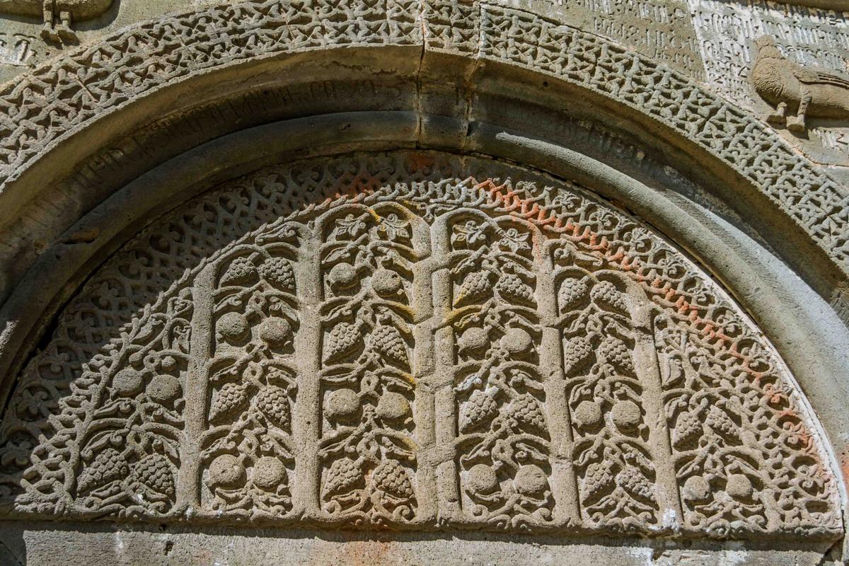 An ornately carved tympanum over the door of the main church at Geghard in Armenia. (ArtNat/Shutterstock)