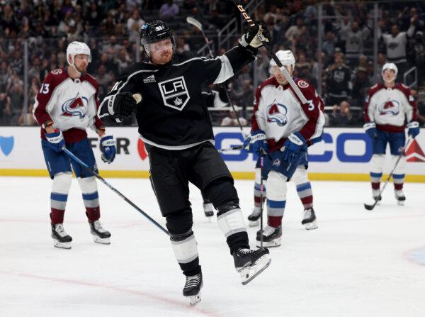 Carl Grundstrom (91) of the Los Angeles Kings celebrates his goal, to trail 3–1 to the ca, during the second period in the Los Angeles Kings season opening game in the Los Angeles Kings season opening game in Los Angeles on Oct. 11, 2023. (Harry How/Getty Images)