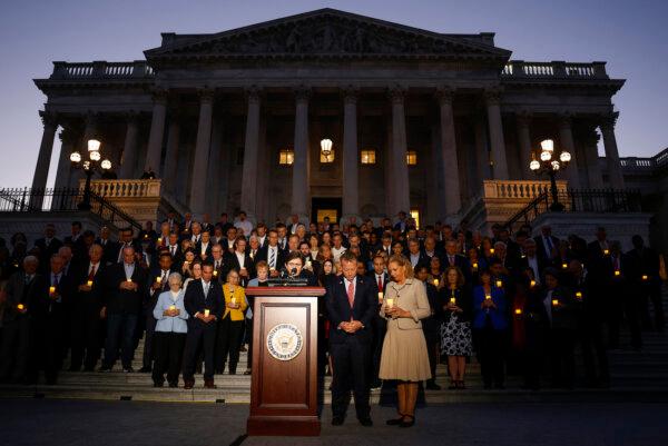 Members of Congress are led in prayer by Margaret Grun Kibben, the chaplain of the U.S. House of Representatives, during a vigil for Israel on the steps of the U.S. Capitol Building in Washington on Oct. 12, 2023. (Anna Moneymaker/Getty Images)