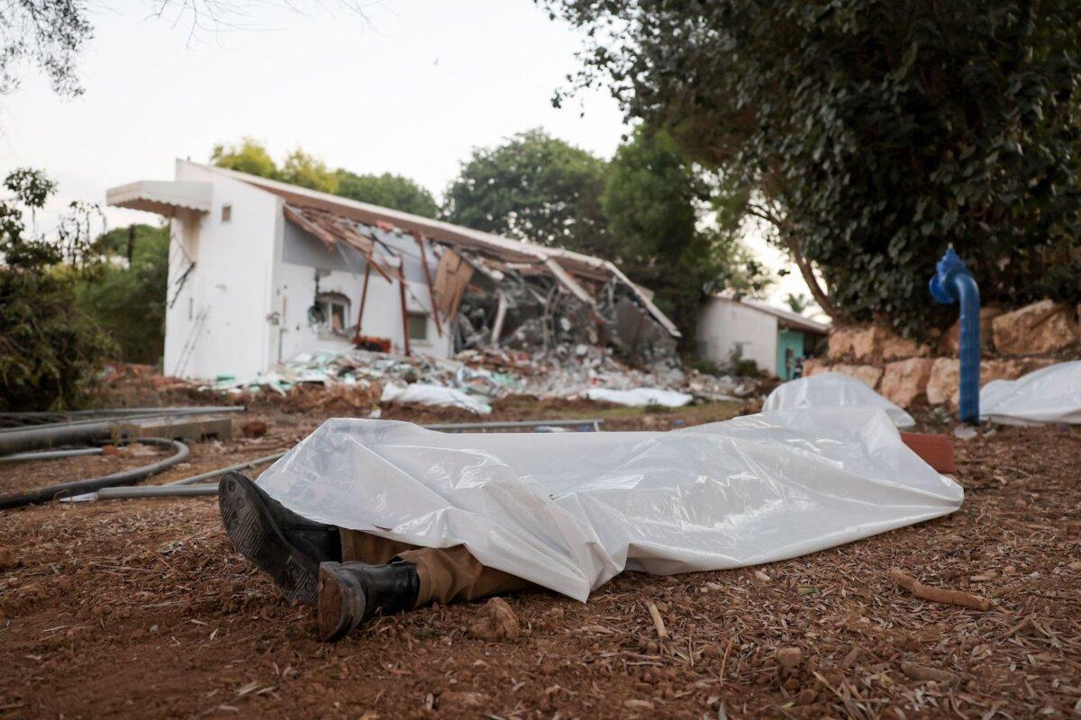Covered bodies at kibbutz Beeri near the border with Gaza, on Oct. 11, 2023, the site of an attack by Hamas terrorists days earlier. (Jack Guez/AFP via Getty Images)