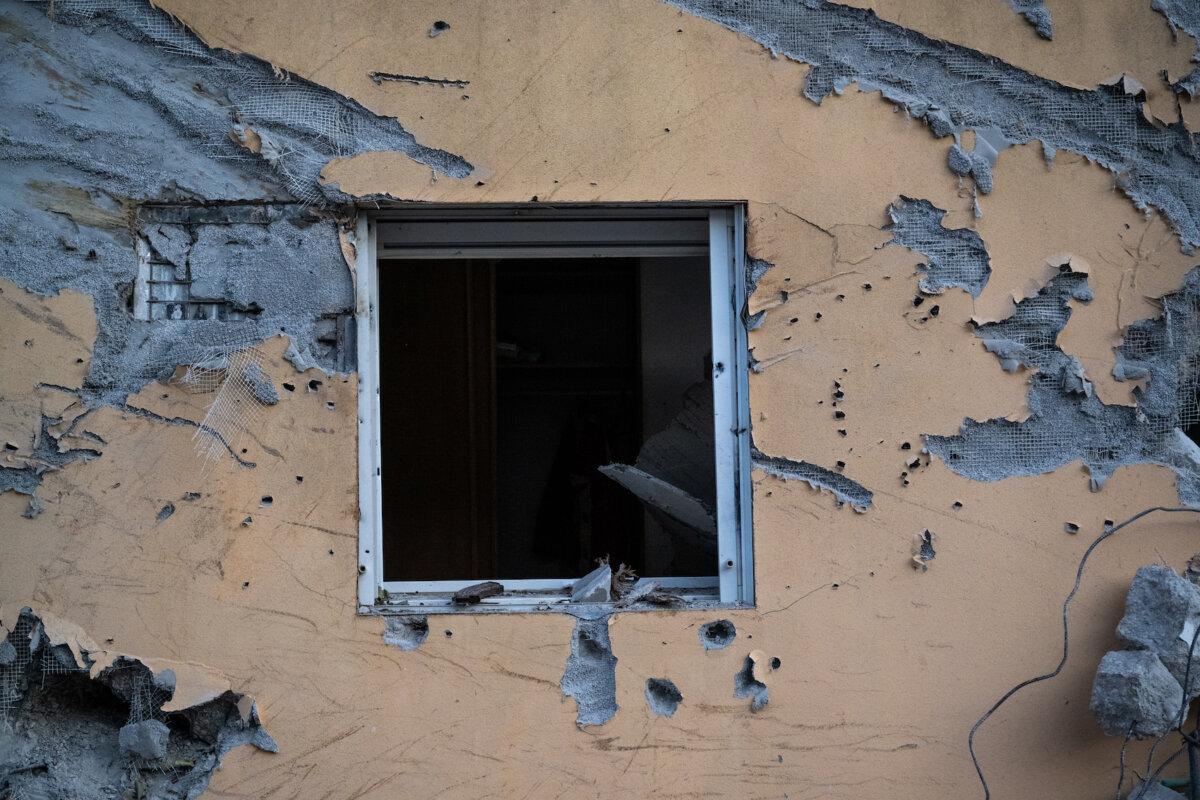 The window of a house is broken and the wall around it is covered in bullet holes where days earlier Hamas terrorists killed over a hundred civilians near the border with Gaza on Oct.11, 2023 in Be'eri, Israel. (Alexi J. Rosenfeld/Getty Images)