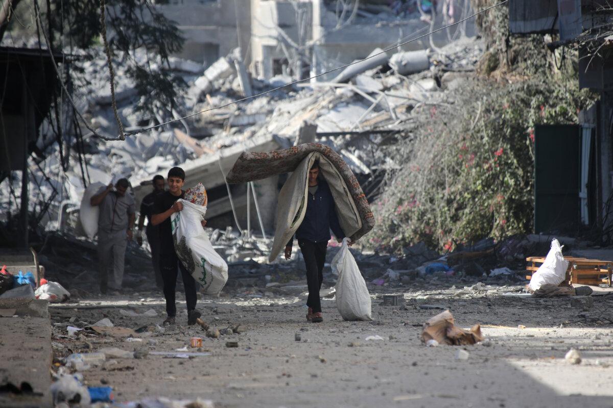 Palestinians displaced from their homes as a result of Israeli raids in Gaza City, Gaza, on Oct. 13, 2023. (Ahmad Hasaballah/Getty Images)