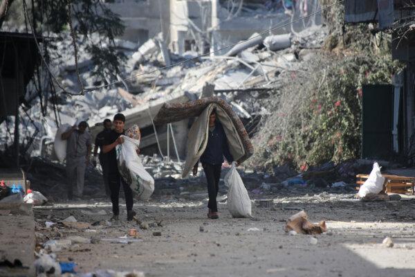 Palestinians displaced from their homes as a result of Israeli raids in Gaza City, Gaza on Oct. 13, 2023. (Ahmad Hasaballah/Getty Images)