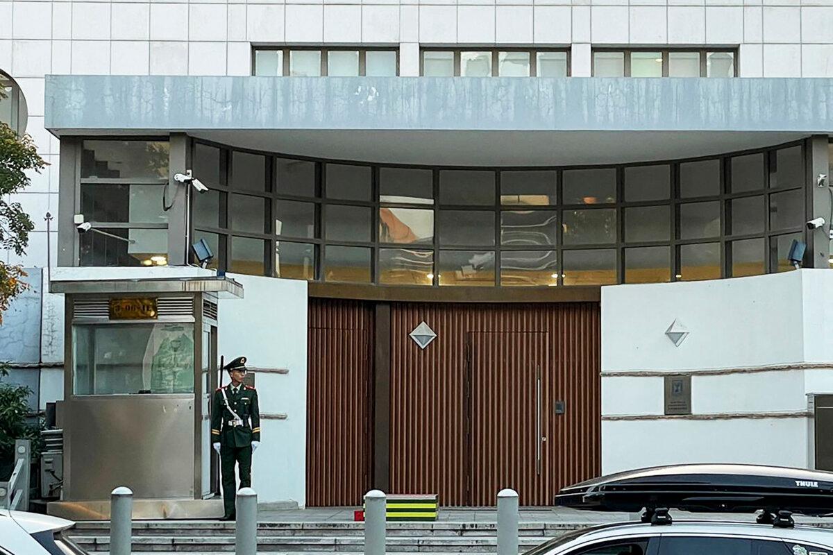 A Chinese paramilitary policeman stands guard at the entrance to the Israeli embassy in Beijing on October 13, 2023, after an embassy employee was attacked elsewhere in the city. (Michael Zhang /AFP via Getty Images)