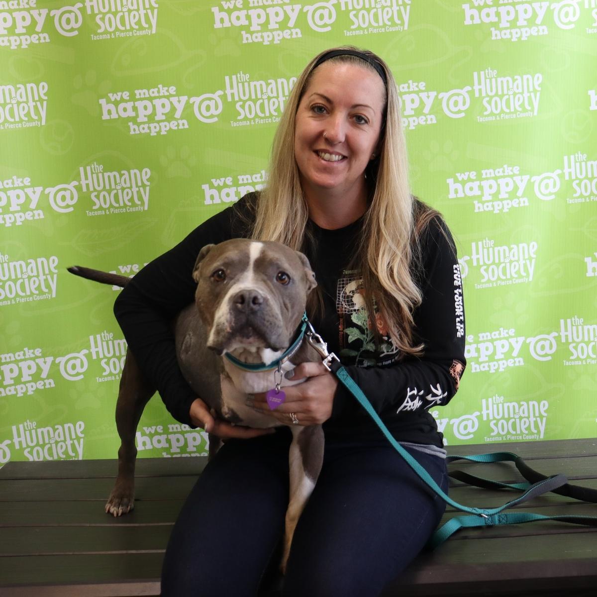 Wiggles and her new owner, a technician who cared for, and fell in love with, the pit bull with a "loving spirit." (Courtesy of The Humane Society for Tacoma & Pierce County)