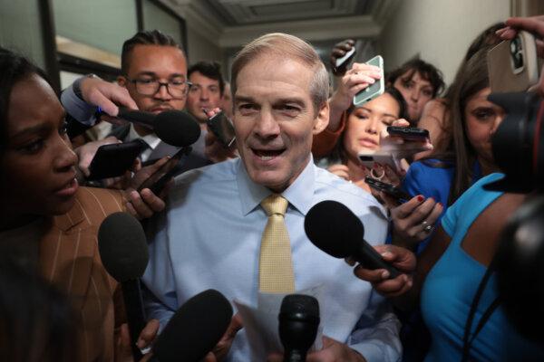 Rep. Jim Jordan (R-Ohio) speaks to reporters as House Republicans hold a caucus meeting at the Longworth House Office Building in Washington on Oct. 13, 2023. (Win McNamee/Getty Images)