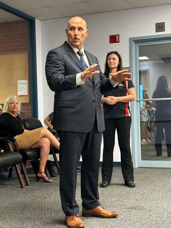 Assistant State Attorney Donald Robert Lewis speaks to members of the community and staff members of the Humane Society of the Nature Coast ahead of the sentencing, on Oct. 12, 2023. (Patricia Tolson/The Epoch Times)