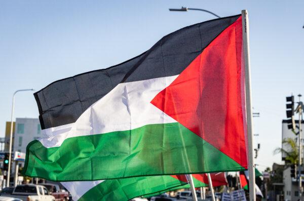 Protesters wave Palestinian flags in Los Angeles, Calif., on Oct. 12, 2023. (John Fredricks/The Epoch Times)