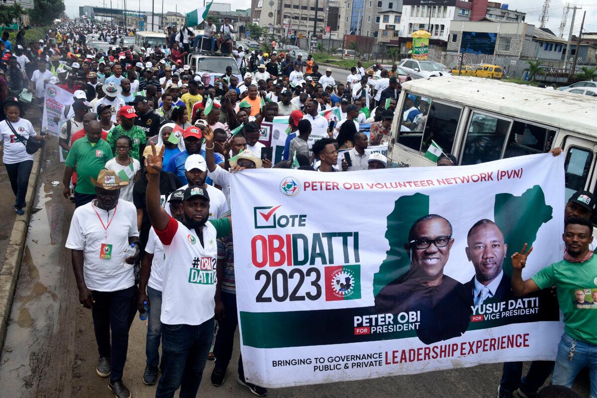 Supporters of the Labour Party presidential candidate Peter Obi and running mate Datti Baba-Ahmed march during a campaign rally in Lagos, Nigeria, on Oct. 1, 2022. (Pius Utomi Ekpei/AFP via Getty Images)