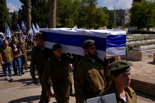 Israeli soldiers carry the flag-covered coffin of Maya Villalobo during her funeral at the military cemetery in Givatayim, Israel, on Oct. 13, 2023. (Francisco Seco/AP)