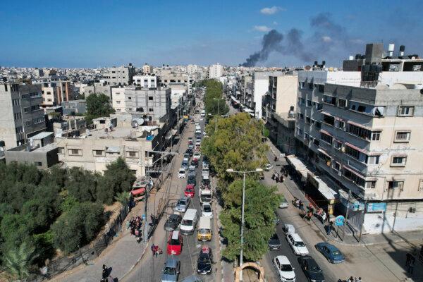 Palestinians flee from northern Gaza to the south after the Israeli army issued an unprecedented evacuation warning to a population of over 1 million people in northern Gaza and Gaza City to seek refuge in the south ahead of a possible Israeli ground operation, Oct. 13, 2023. (Hatem Moussa/AP)