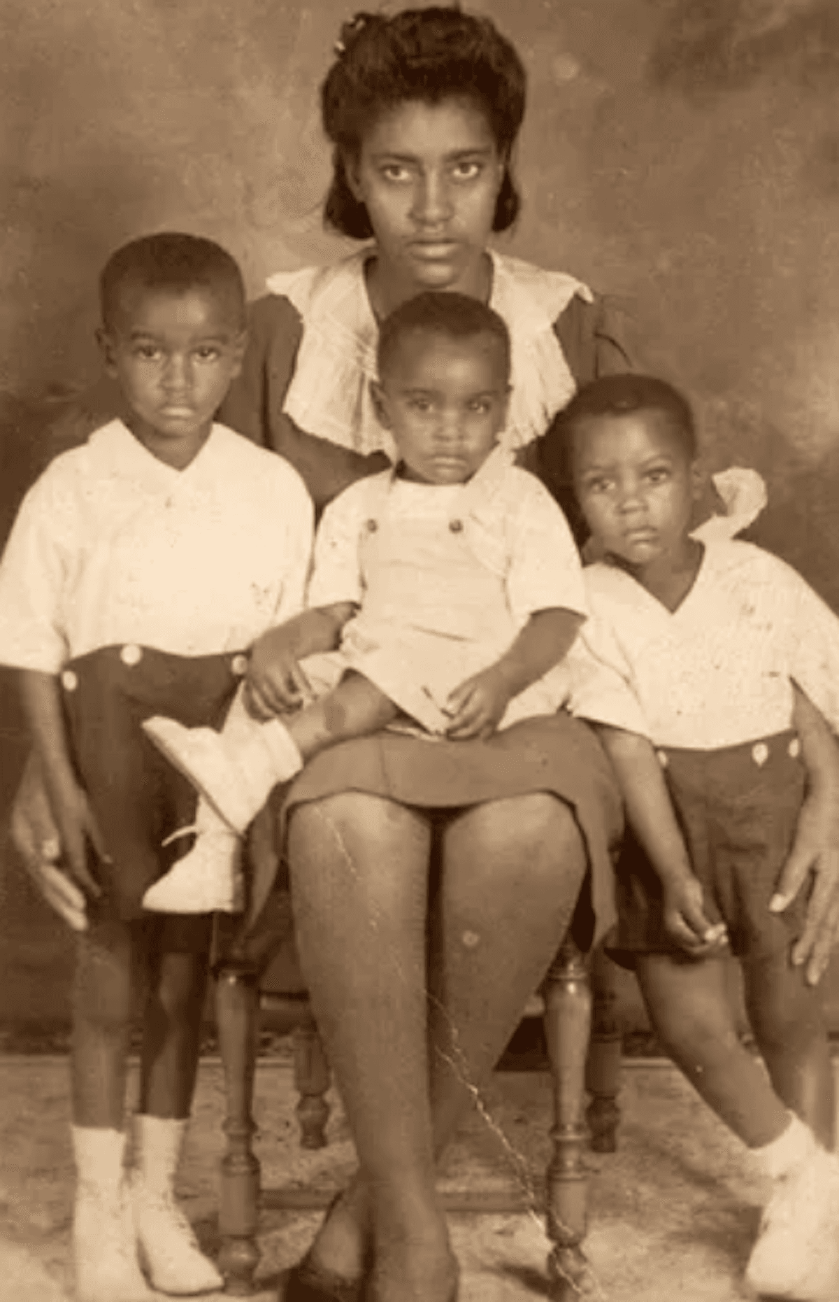  Ms. Whiteside at 19 with her sons Cleovis Jr., James, and Willie. (Courtesy of Kathy Whiteside-Sims)