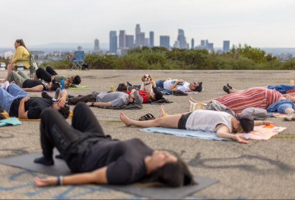 Participants engage in breathing exercises during the Natural High alcohol-free party at Elysian Park on Sept. 9, 2023, in Los Angeles. (Myung J. Chun/Los Angeles Times/TNS)