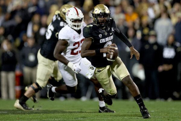 Quarterback Shedeur Sanders (2) of the Colorado Buffaloes runs with the ball against the Stanford Cardinal in the second quarter at Folsom Field in Boulder, Colo., on Oct. 13, 2023. (Matthew Stockman/Getty Images)