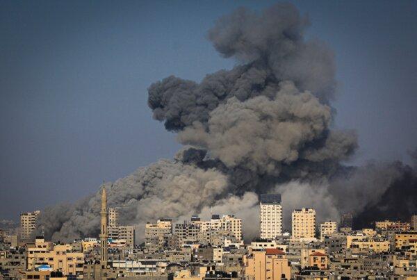 Smoke billows during Israeli air strikes on Hamas targets in Gaza City on Oct. 12, 2023. (Mahmud Hams/AFP via Getty Images)