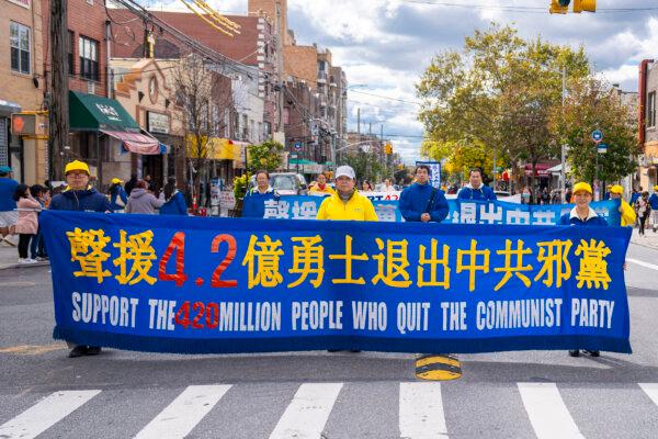 Falun Gong practitioners walk in a parade highlighting the Chinese regime's persecution of their faith, in Brooklyn, N.Y., on Oct. 15, 2023. (Chung I Ho/The Epoch Times)