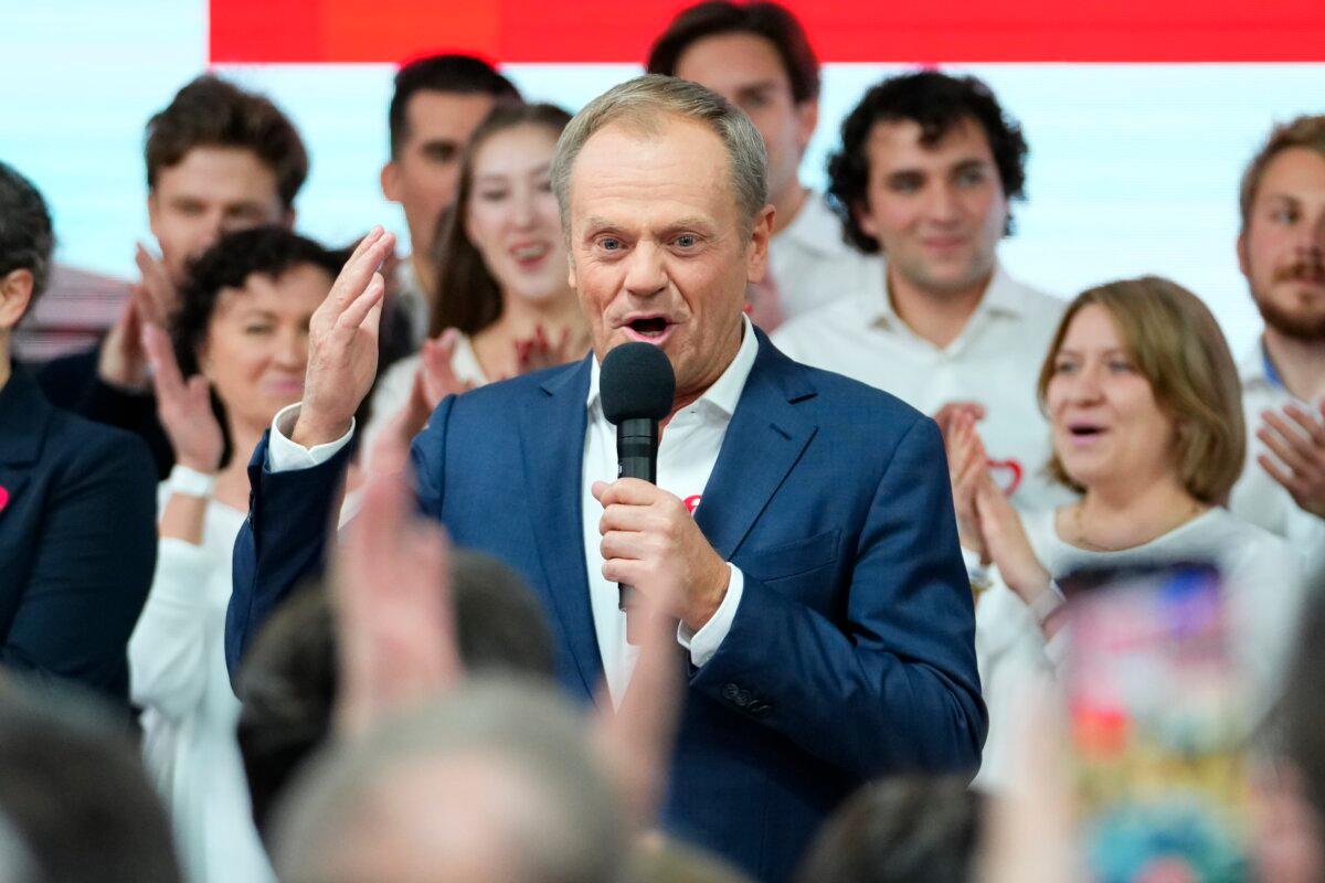 Former Polish Prime Minister Donald Tusk addresses supporters at his party headquarters in Warsaw, Poland, on Oct. 15, 2023. (Petr David Josek/AP Photo)