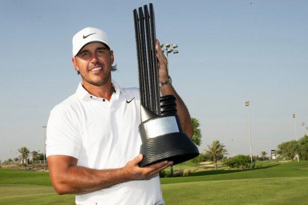 First Place Individual Champion Captain Brooks Koepka, of Smash GC, celebrates with the trophy after winning the LIV Golf Jeddah tournament in King Abdullah Economic City, Saudi Arabia, on Oct. 15, 2023. (Chris Trotman/LIV Golf via AP)