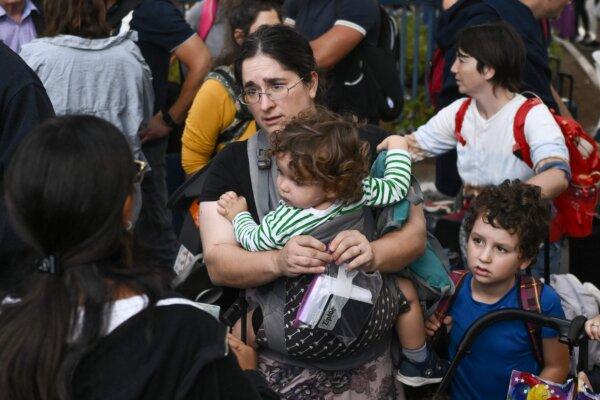 U.S. citizens wait at the port of Haifa to be evacuated to Cyprus on Oct. 16, 2023. (Aris Messinis/AFP via Getty Images)