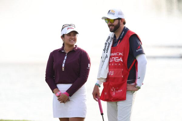 Lilia Vu, of Fountain Valley, Calif.,  and her caddie react on the 17th green during the final round of the Buick LPGA Shanghai at Shanghai Qizhong Garden Golf Club in Shanghai on Oct. 15, 2023. (Zhe Ji/Getty Images)