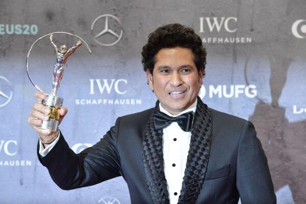 Laureus Best Sporting Moment award winner, Sachin Tendulkar from India’s Men Cricket Team, poses with the trophy on the red carpet after the 2020 Laureus World Sports Awards ceremony in Berlin on Feb. 17, 2020. (Tobias Schwarz/AFP via Getty Images)