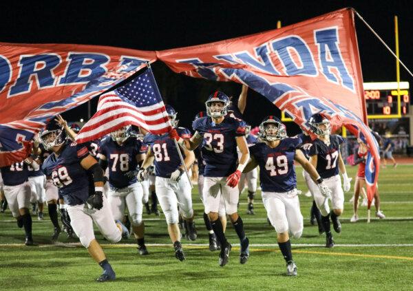 Yorba Linda High School varsity football team enters the field for a game on Oct. 13, 2023. (Courtesy of Emma Perron Photography)