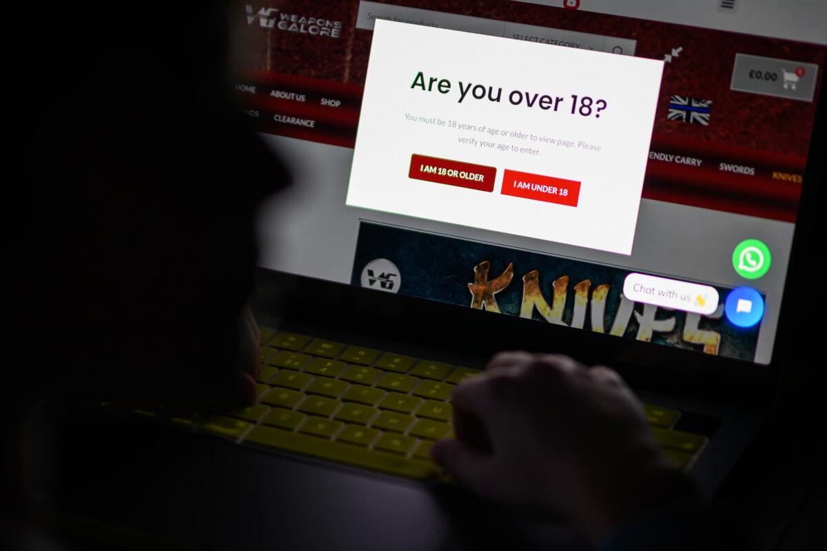 A teenage child looks at a screen of age-restricted content on a laptop screen in London, on Jan. 17, 2023. (Leon Neal/Getty Images)