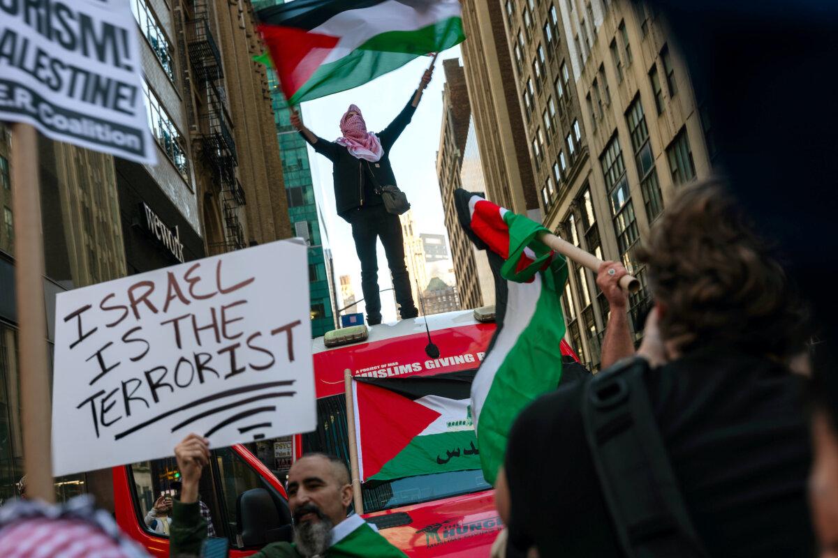 Supporters of Palestine participate in a rally in response to the Israel-Hamas war, in Times Square, in New York, on Oct. 13, 2023. (Spencer Platt/Getty Images)