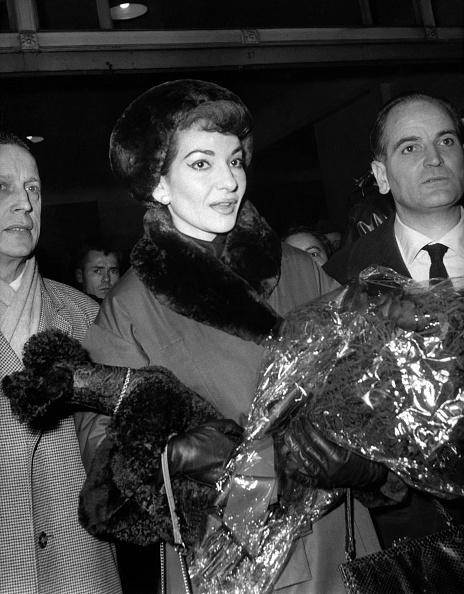 Maria Callas arrived at the Gare de Lyon in Paris on Dec. 16, 1958. holding a bouquet offered by an admirer, is preparing to be the star of the sumptuous gala of the Paris Opera. (AFP via Getty Images)