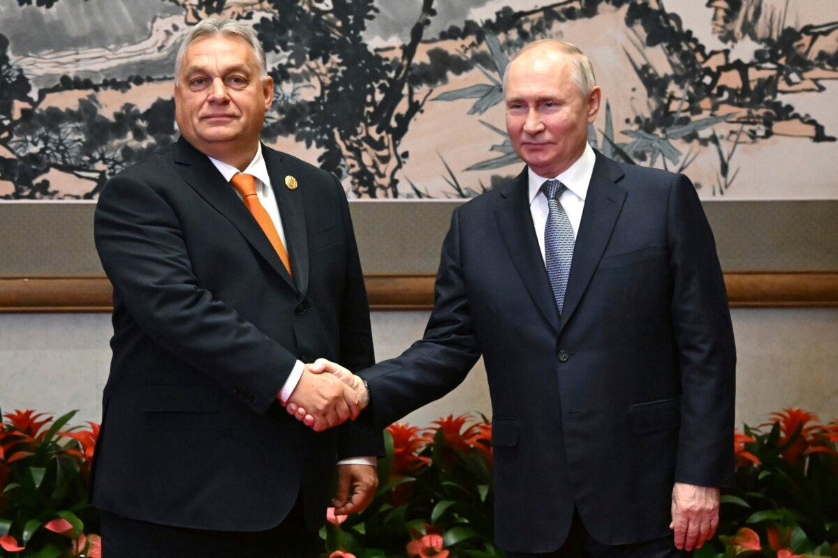 Russian President Vladimir Putin (R) and Hungarian Prime Minister Viktor Orban pose for a photo prior to their talks on the sidelines of the Belt and Road Forum in Beijing on Oct. 17, 2023. (Grigory Sysoyev/Sputnik, Kremlin Pool Photo via AP)