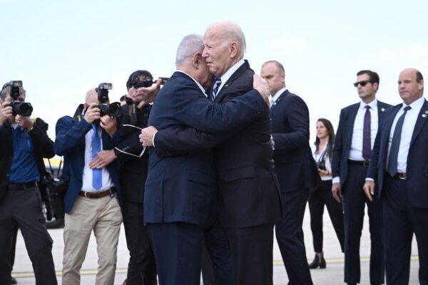 Israel Prime Minister Benjamin Netanyahu (L) hugs US President Joe Biden upon his arrival at Tel Aviv's Ben Gurion airport on Oct. 18, 2023. (Brendan Smialowski/AFP via Getty Images)