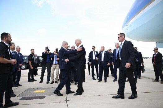 Israeli Prime Minister Benjamin Netanyahu greets U.S. President Joe Biden upon his arrival at Tel Aviv's Ben Gurion Airport on Oct. 18, 2023. (Brendan Smialowski/AFP via Getty Images)