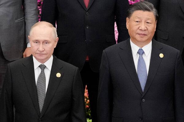 Russia's President Vladimir Putin (L) and Chinese leader Xi Jinping gather with other leaders for a group photo session at the third Belt and Road Forum for International Cooperation at the Great Hall of the People in Beijing on Oct. 18, 2023. (Suo Takekuma/AFP via Getty Images)