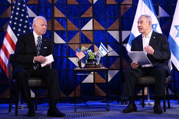 President Joe Biden (L) listens as Israel's Prime Minister Benjamin Netanyahu reads a statement before their meeting in Tel Aviv, Israel, on Oct. 18, 2023. (Brendan Smialowski/AFP via Getty Images)