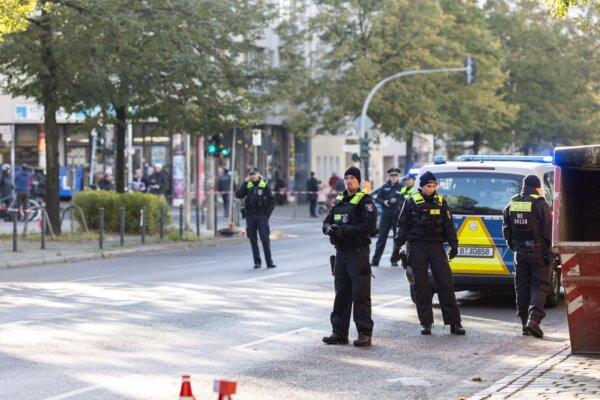Police stand outside a building that houses a synagogue and school of the Kahal Adass Jisroel Jewish community following a pre-dawn attack in Berlin, Germany, on Oct. 18, 2023. (Maja Hitij/Getty Images)