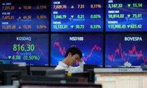 Stock Market Today: Asian Markets Edge Lower as China Reports Slower Growth in Last Quarter