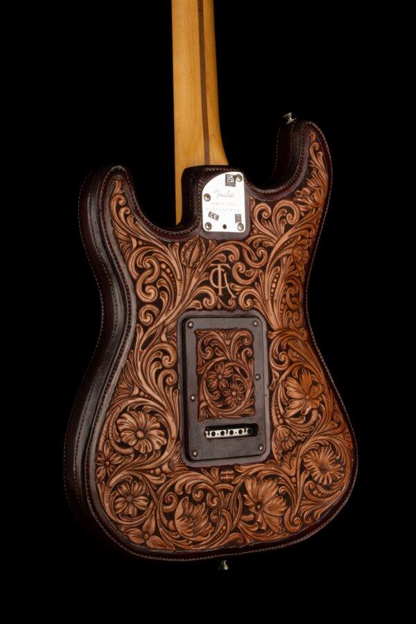 “Tooled Leather Fender Stratocaster,” 2018, by saddlemaker Troy West. Fender American Professional II Stratocaster; Hand sewn and carved leather. (National Cowboy & Western Heritage Museum)