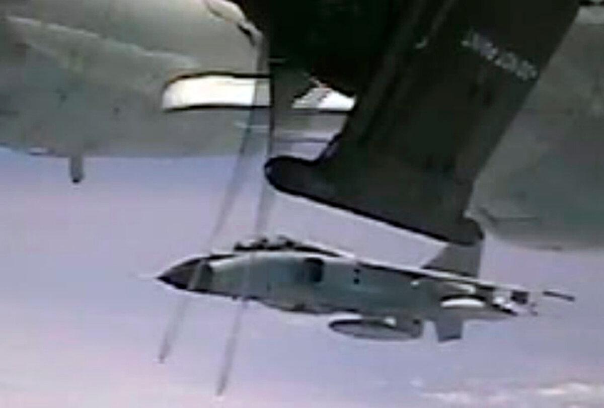 This image from video shows an intercept of a U.S. military plane by a Chinese fighter jet over the Pacific Ocean on May 24, 2022. (Department of Defense via AP)