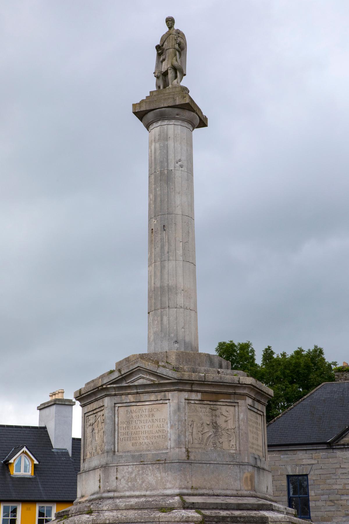 A view of the Octagon with its column and the statue of St. Patrick, in the town of Westport, in County Mayo Ireland.
