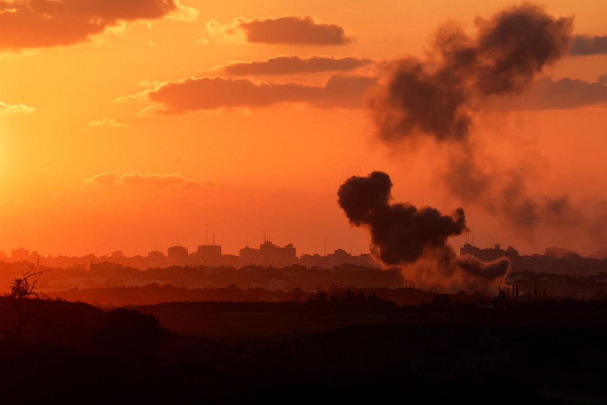 Smoke in the Gaza Strip as seen from Israel's border with the Gaza Strip, in southern Israel, on Oct. 18, 2023. (Amir Cohen/Reuters)