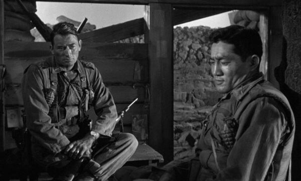 Lts. Joe Clemons (Gregory Peck, L) and Suki Ohashi (George Shibata), in “Pork Chop Hill.” (United Artists)
