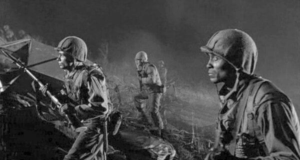 The men of K Company, including Private Franklin (Woody Strode, R), make their move, in “Pork Chop Hill.” (United Artists)