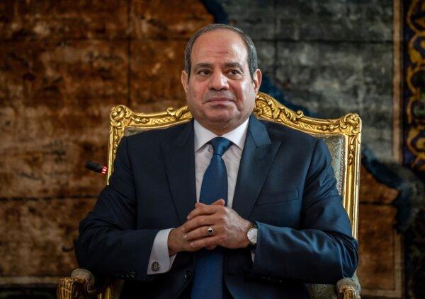 Egypt's President Abdel Fattah al-Sisi sits with the German Chancellor during their meeting in Cario on Oct. 18, 2023. (Michael Kappeler/Pool/AFP via Getty Images)