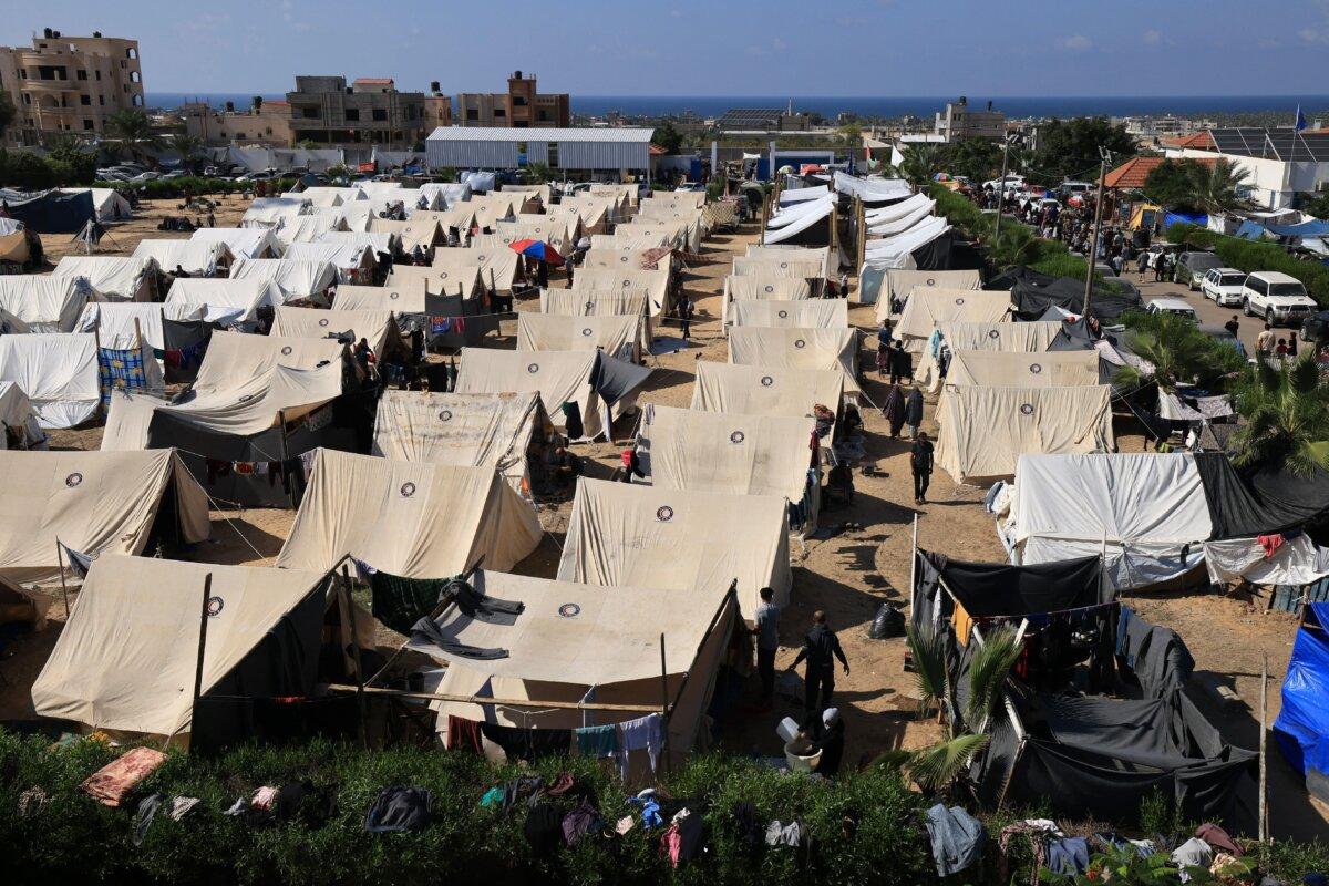 Tents for Palestinians seeking refuge are set up on the grounds of a United Nations Relief and Works Agency for Palestine Refugees (UNRWA) center in Khan Yunis in the southern Gaza Strip, on Oct. 19, 2023. (Mahmud Hams/AFP via Getty Images)